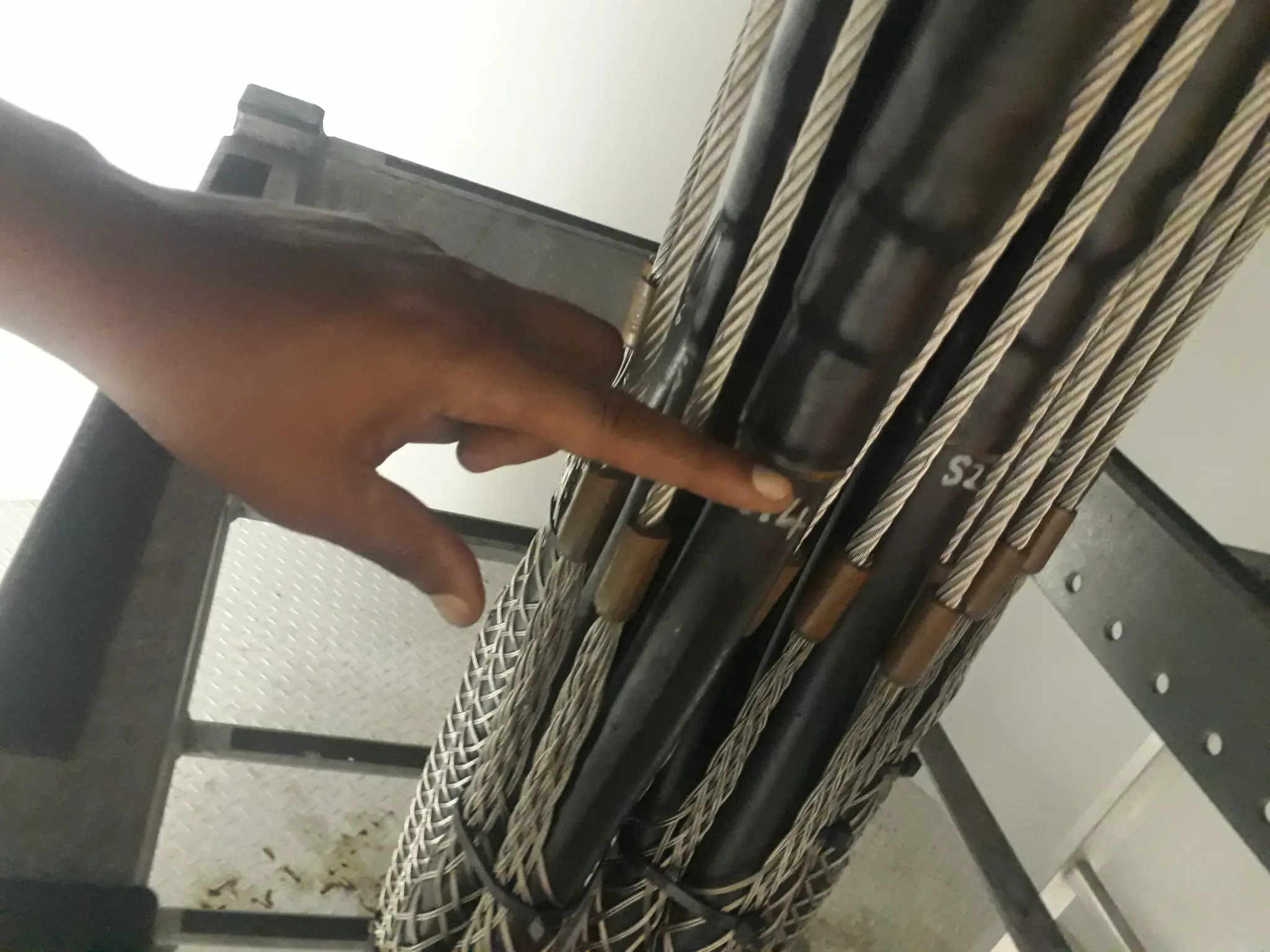 Technician conducting cable checks on a renewable-energy asset